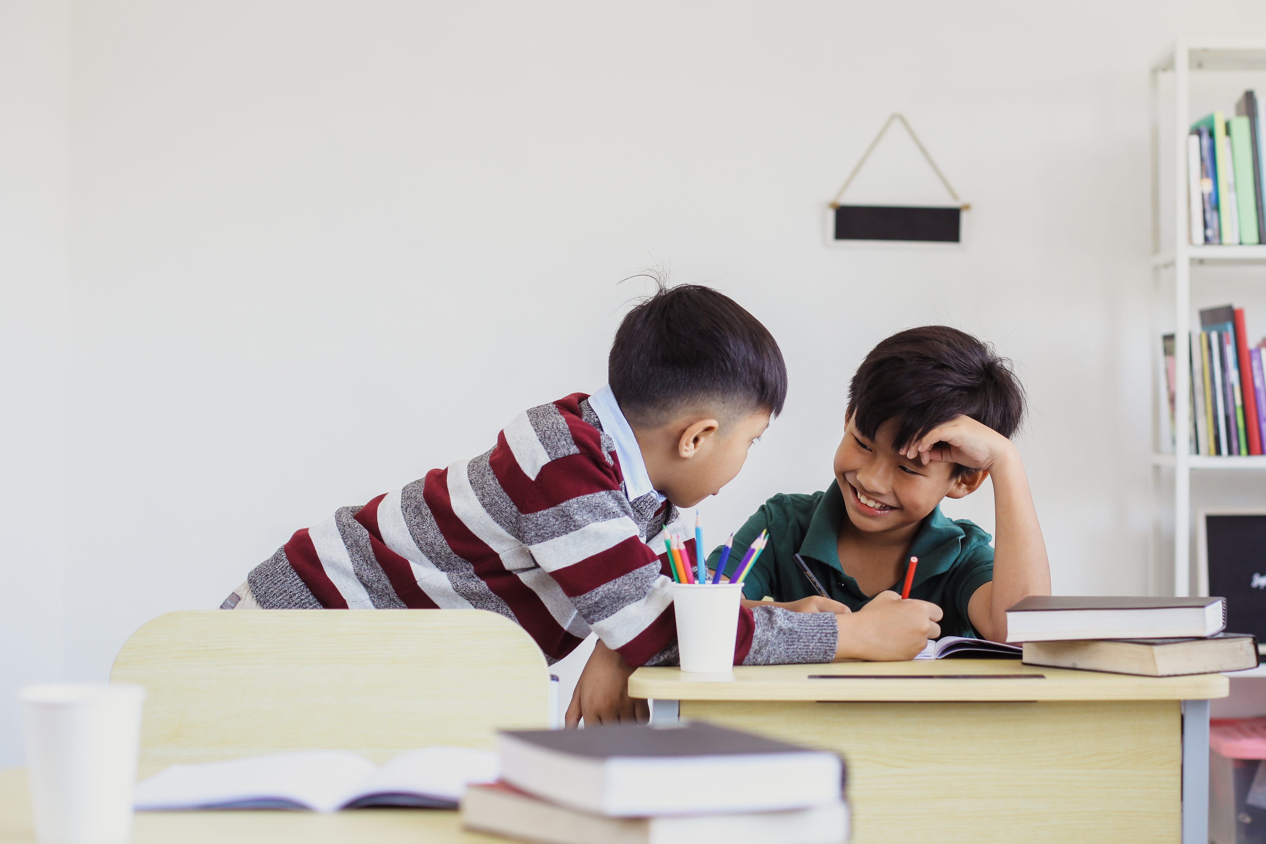A student helping out his classmate