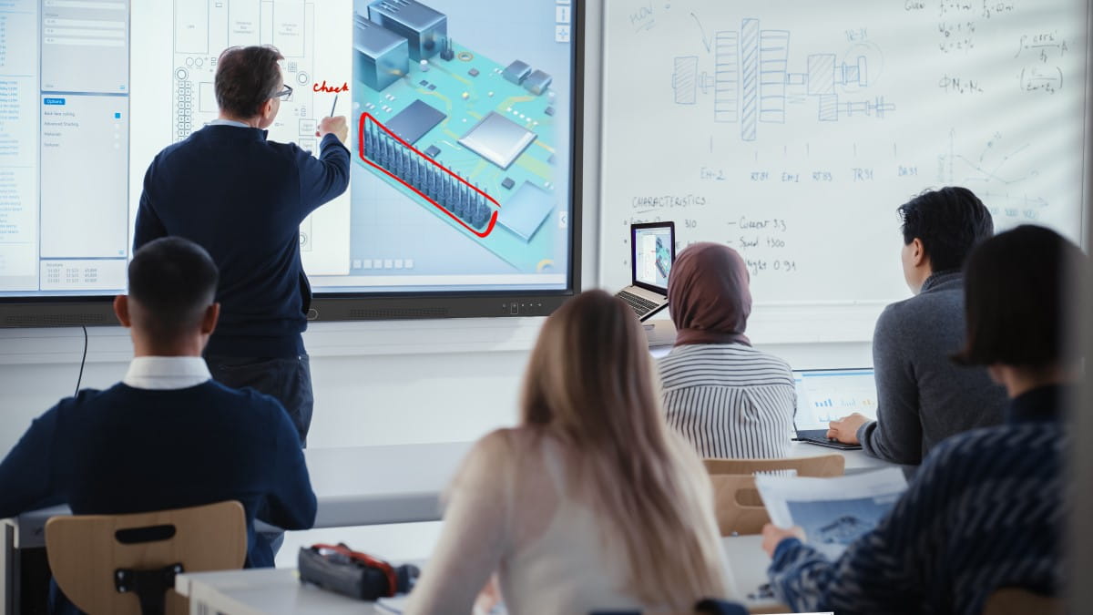Lecture in progress with a focus on a SMART Board display where a 3D architectural design is being discussed.