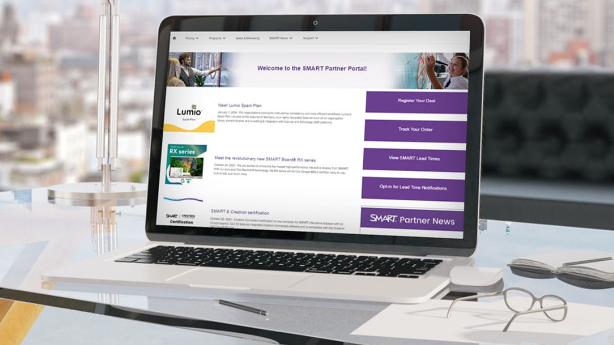 Laptop screen showing the SMART Partner Portaloffering resources for partners to track orders, register deals, and view product information.